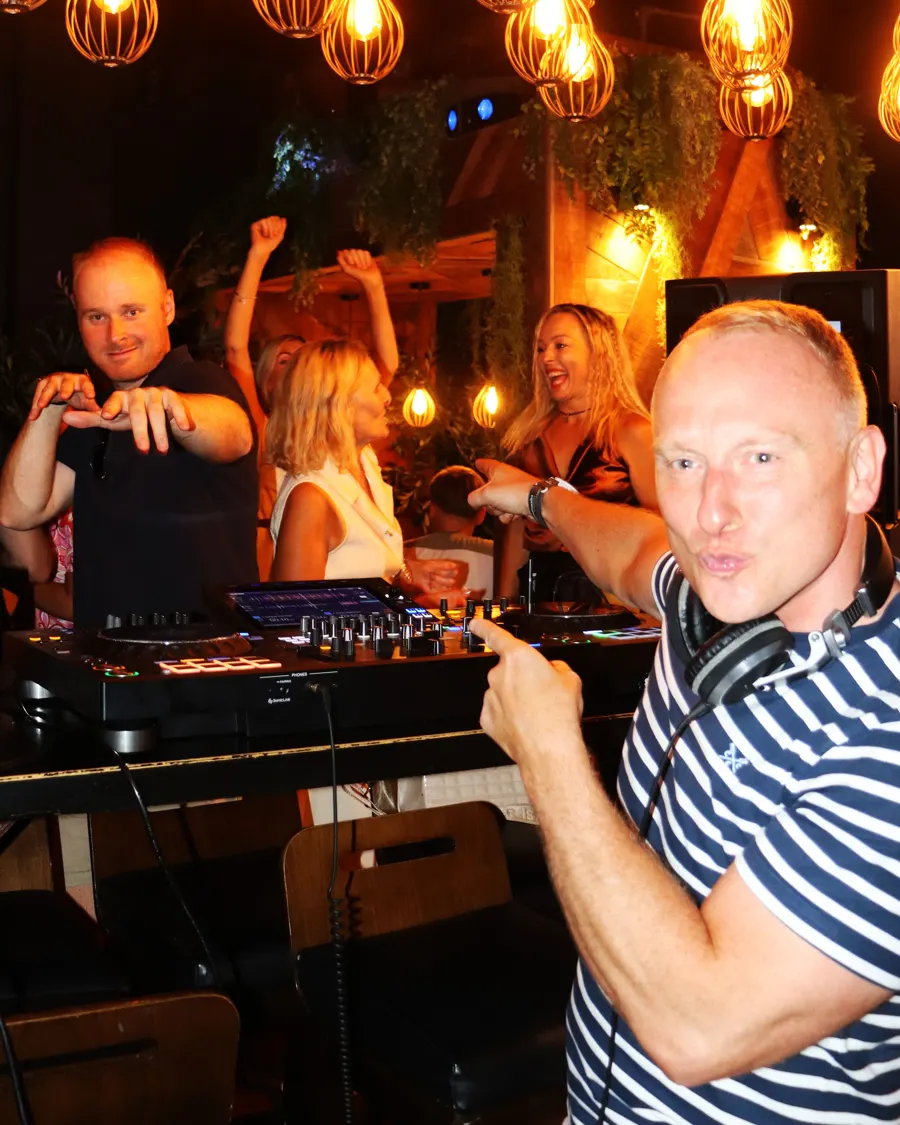 The DJ booth and dance floor in full swing